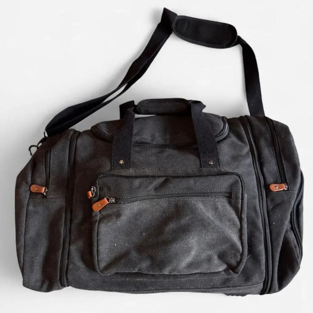 Sucipi Black canvas duffle bag with leather accents